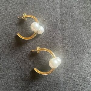 Two white pearl earrings